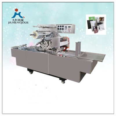 廠家直銷九恒牌JZ-350型轉(zhuǎn)塔式奶粉盒薄膜三維包裝機煙包機